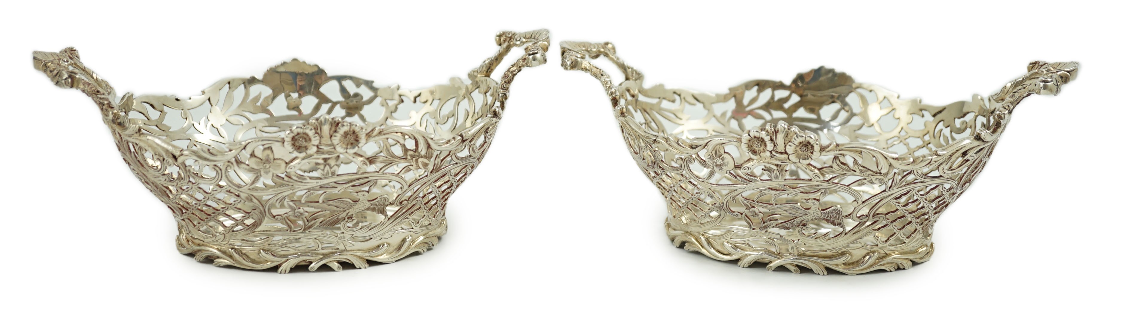 A pair of Edwardian pierced silver two handled bon bon dishes, by William Comyns